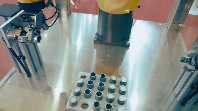 Industrial robot arm prepares the details for future use