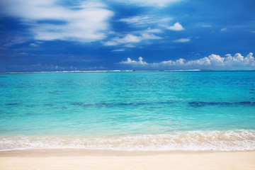 Beautiful landscape: turquoise ocean water and sandy beach, background