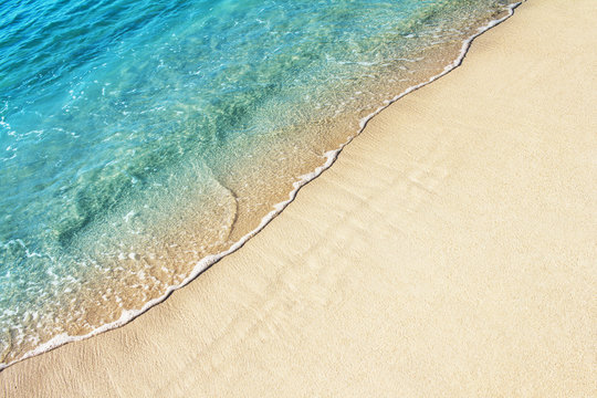 Soft ocean wave on the sandy beach, background.
