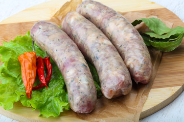 Raw sausages for cooking