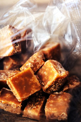 Sweet caramel candies.  Salted caramel pieces and sea salt close