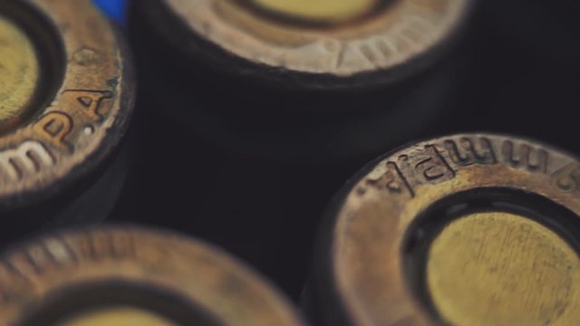 Rows of new, not shooting bullet caliber 9mm. Closeup. Color correction