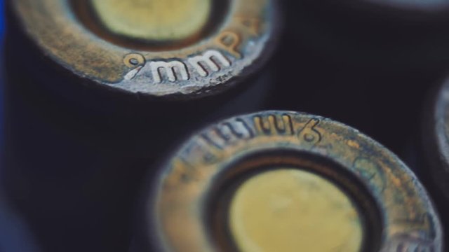 Rows of new, not shooting bullet caliber 9mm. Closeup. Color correction