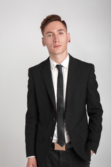 young man in a black suit