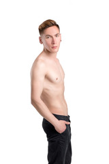 Fototapeta premium young naked man in pants isolated on white background