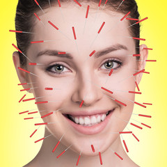 Close-up of performing acupuncture therapy on face