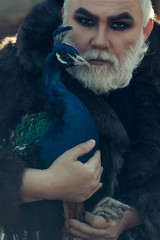 bearded man with peacock