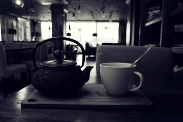 teapot and cup of tea at a cafe