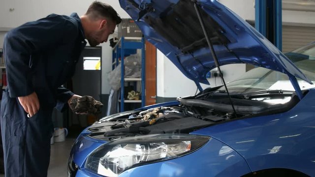 Mechanic overhauling an engine in the garage