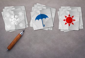 weather concept with pencil and white paper note with symbol