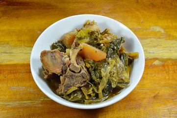 Chinese mixed vegetable and pork bone stew on bowl