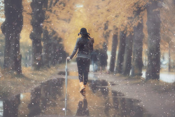 autumn landscape city woman umbrella rain puddles of yellow trees