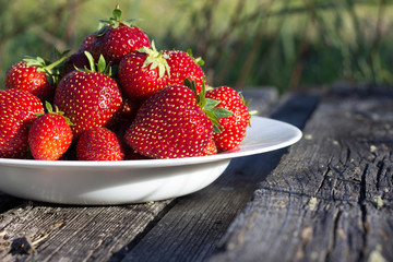 Ripe strawberries on plate
