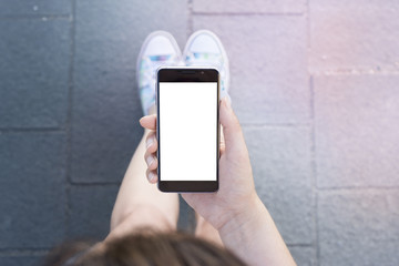 Woman hand holding contemporary modern smartphone. Visual effects. Blank display replaceable with needed design.Vertical mockup