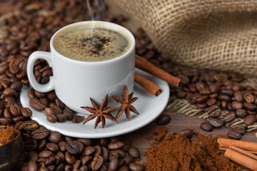 A cup of coffee and coffee beans