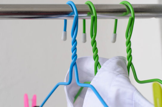 white shirts drying on a clothes line.
