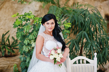 Temptation model brunette bride at exciting wedding dress posed