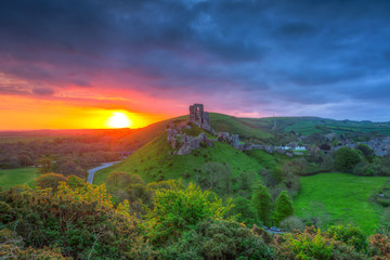 Fototapeta na wymiar Ruins of the Corfe castle at beautiful sunrise in County Dorset, UK