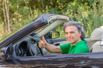 happy man on convertible car