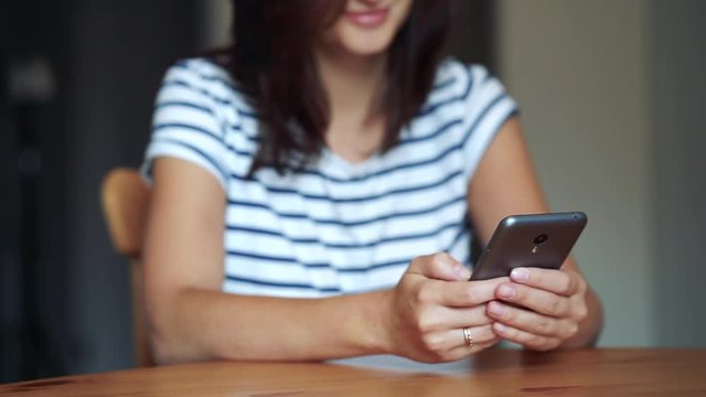 Closeup of hands typing sms