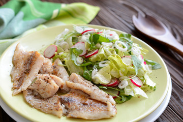 Roasted cod with fresh radish, lettuce and arugula salad