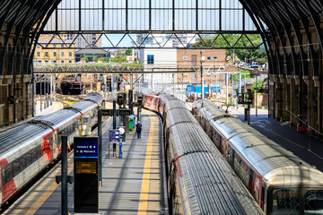 Trains stop at the platforms in Kings Cross train station