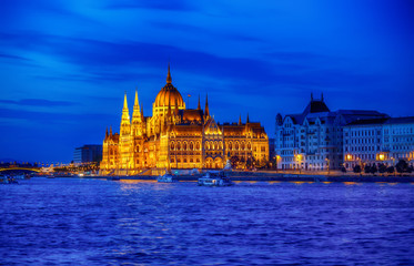 Naklejka premium Late evening illumination of hungarian parliament in budapest