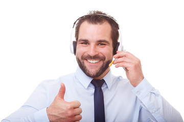 Man with headset makes a gesture with his thumb up