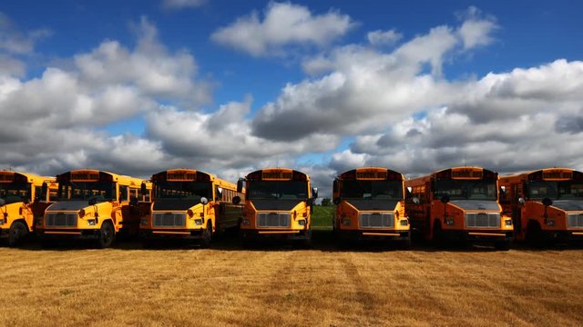 4K UltraHD Timelapse view of parked school buses