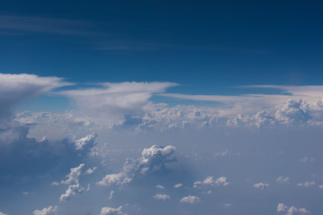 Fototapeta na wymiar Beautiful blue sky and cloud view from an airplane window. background