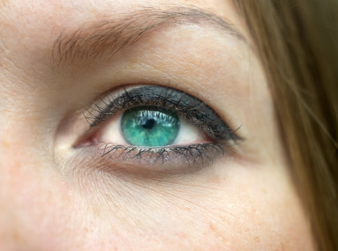 Green female eye close-up