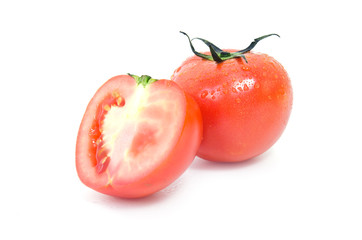 Tomato fruit with half cross section isolated on white backgroun