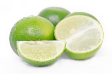 Lemon or lime fruit with half cross section and partial section