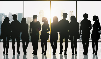 people silhouettes over window and city background