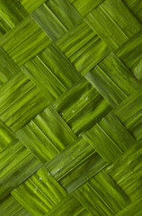 A close up of woven leaves 