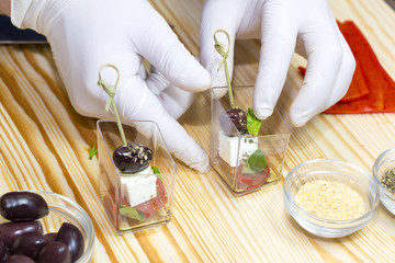 cooking mini canapes of meat and vegetable sauces