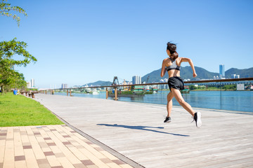 Woman jogging on the boardwalk