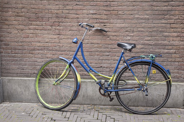 Fototapeta na wymiar Colorful Bike against Wall, Holland