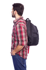 Side view of a male student holding a backpack, isolated on whit