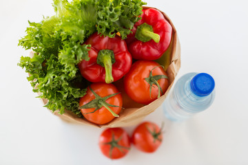 basket of fresh vegetables and water at kitchen