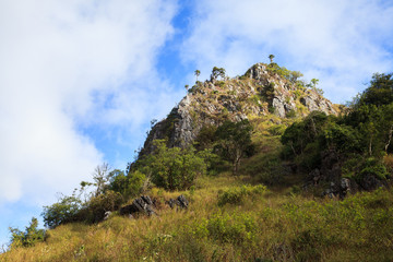 mountain peak and raining fog blue sky