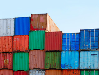 Fototapeta premium Stack of Cargo Containers at the Docks ready for Shipping