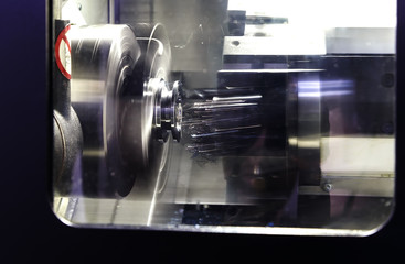 operator machining mold and die of automotive parts by high precision CNC lathe multi axis
