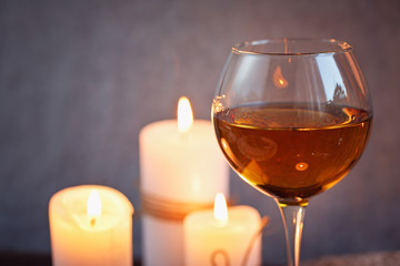 Romantic dinner with wine and candles on a table