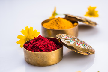 huldi kumkum or kum kumwith flowers, isolated over white background, indian tradition, Makar Sankranti hindu festival also known as huldi-kumkum occassion © StockImageFactory