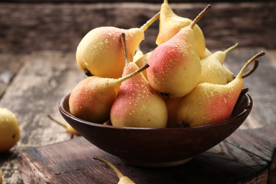 ripe pears on vitage wooden table