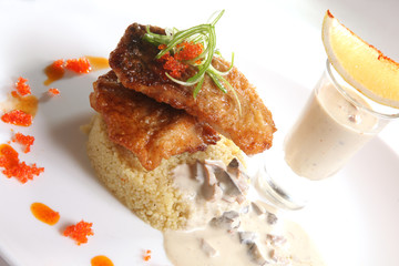 Fried CARP with garnish and mushroom sauce