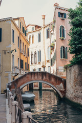 Fototapeta na wymiar Travel photo: view on cana and ancient historical houses in Venice, Italy, popular touristic place