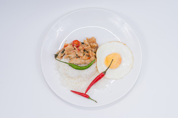 Stir-fried pork with rice , egg and pepper.