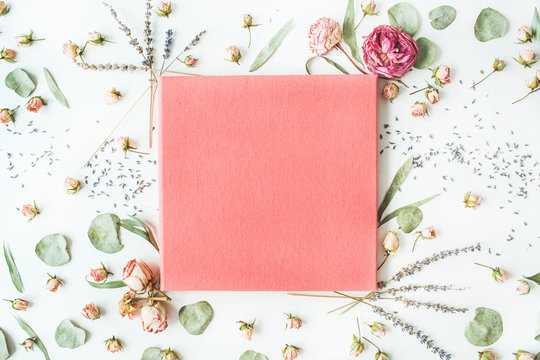 pink wedding or family photo album, roses, lavender, branches, leaves and petals isolated on white background. flat lay, overhead view